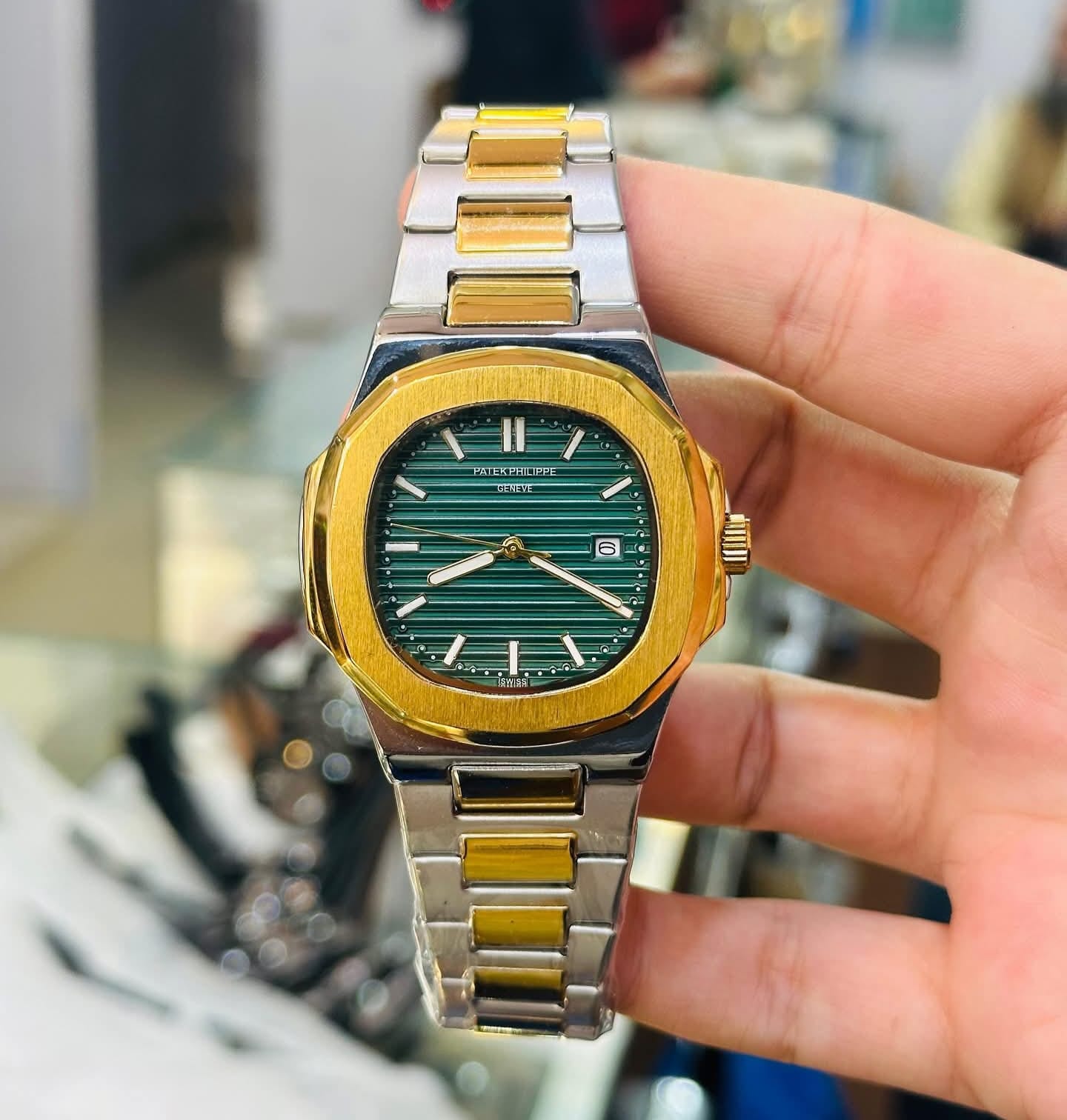 Patek Philippe (PP) - Nautilus Silver & Gold with Green Dial