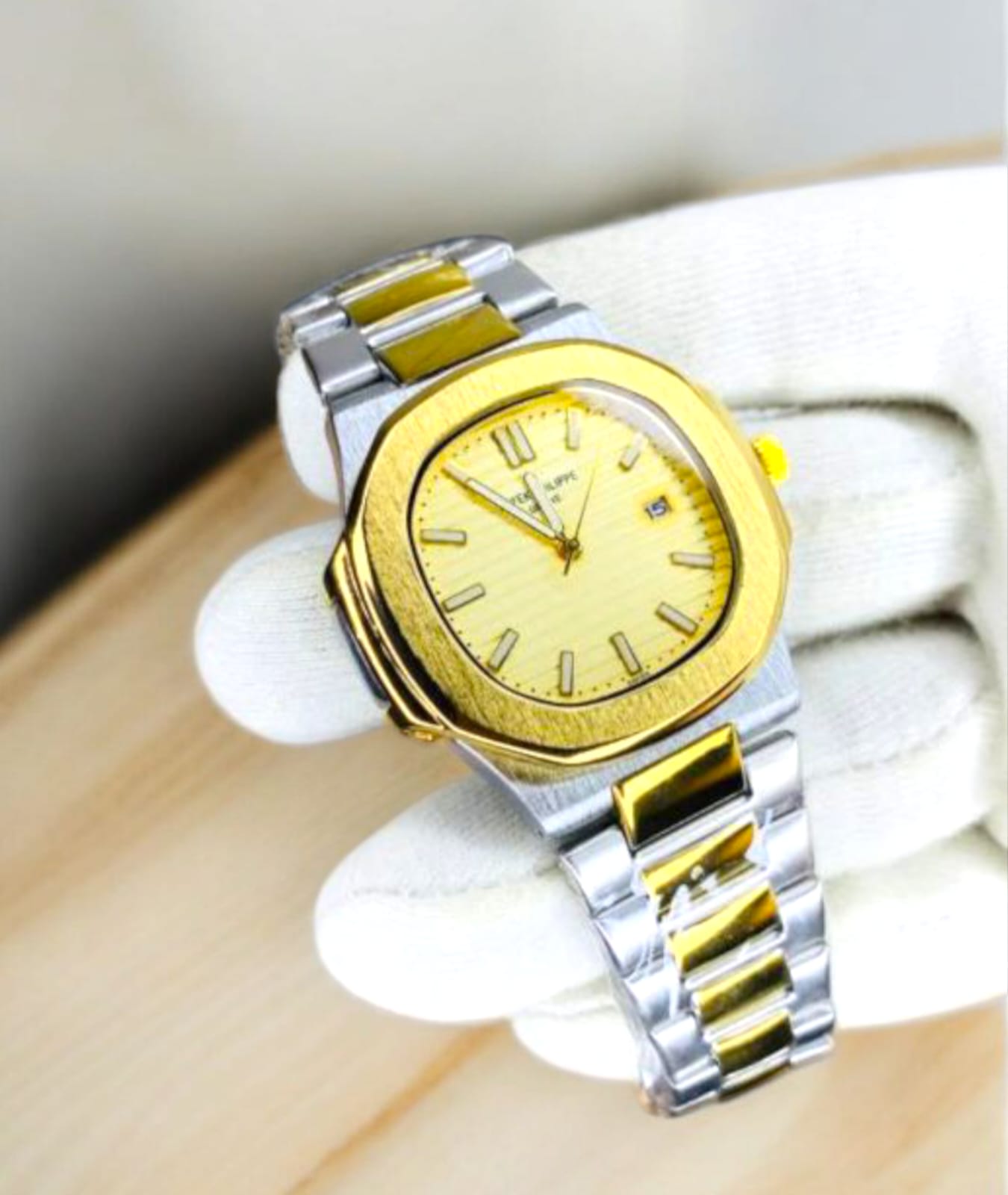 Patek Philippe (PP) - Nautilus Two-Tone with Golden Dial